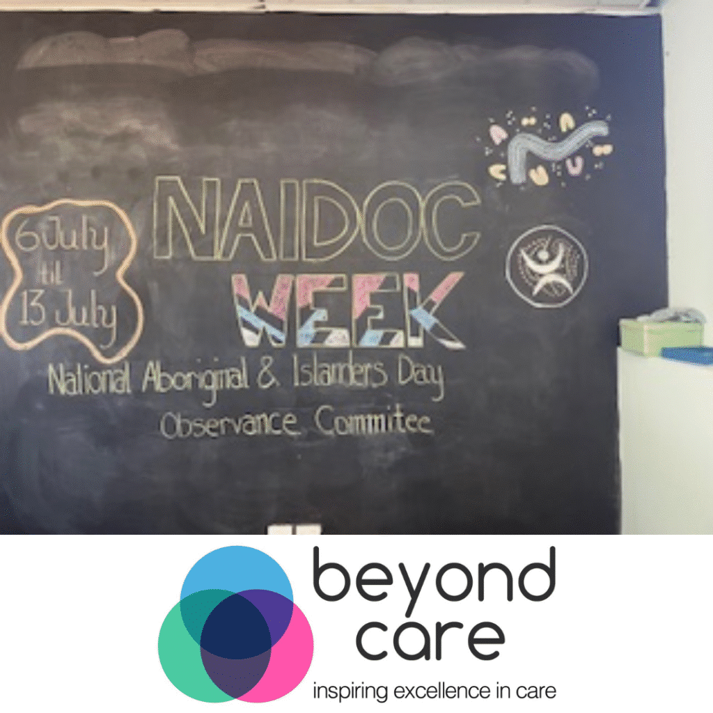 A chalkboard displays "NAIDOC WEEK" with dates 6 July to 13 July, and "National Aboriginal & Islanders Day Observance Committee," above the Beyond Care logo.