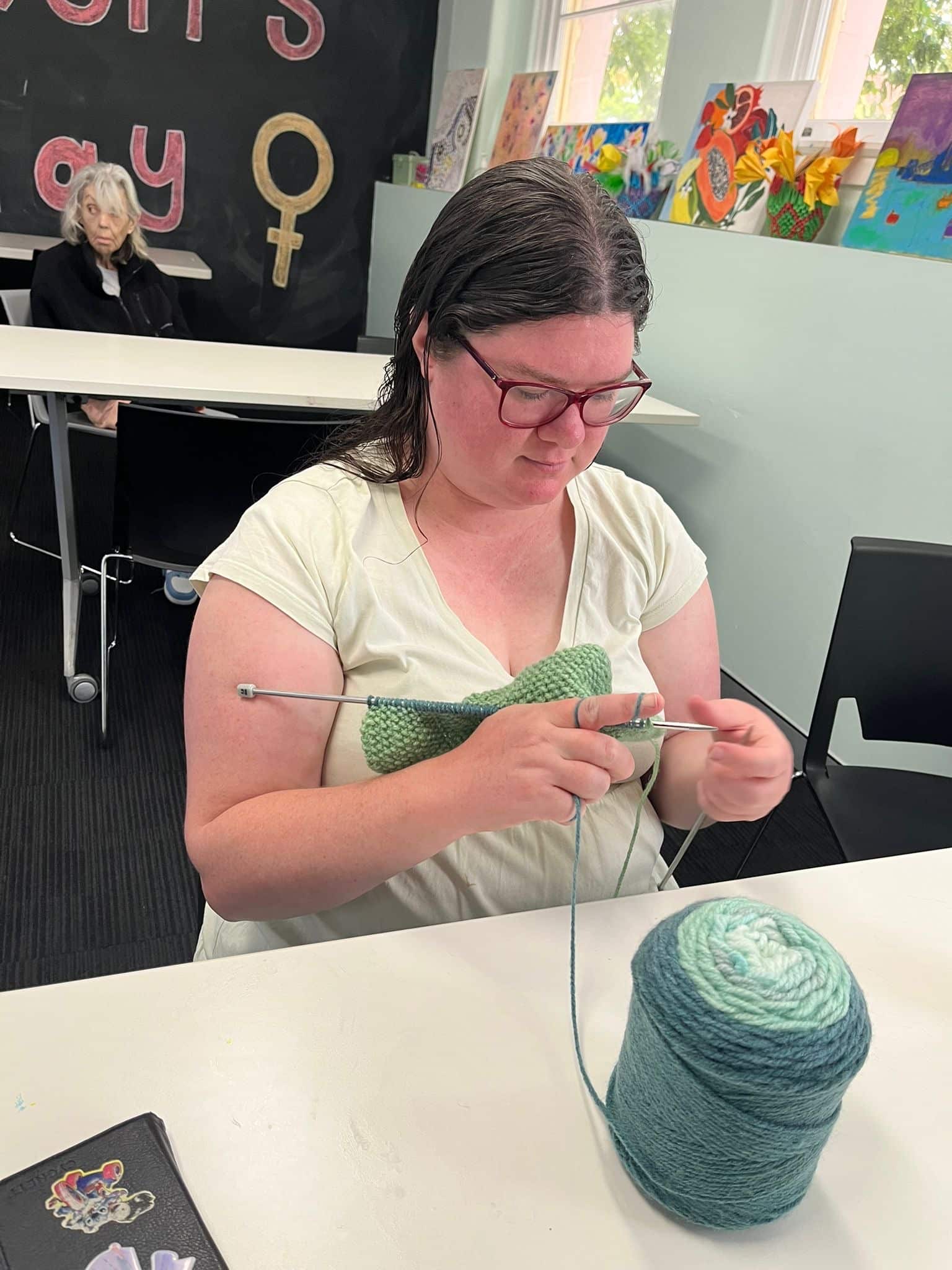 Participant taking part in a knitting activity