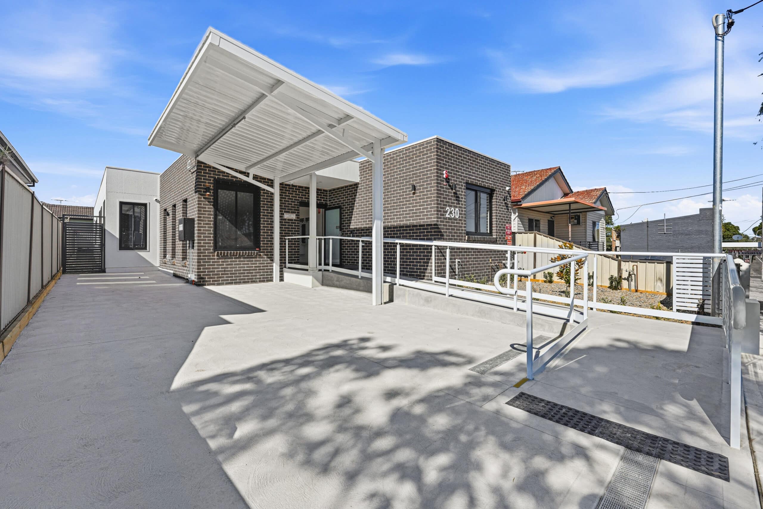 Front entrance and covered carport of the Beyond Care Auburn SDA home