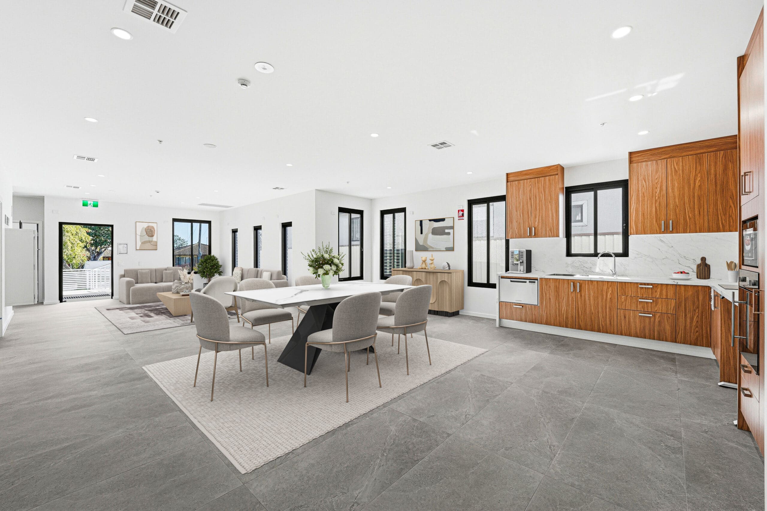 Open plan lounge, dining area and modern kitchen at the Beyond Care Auburn SDA home