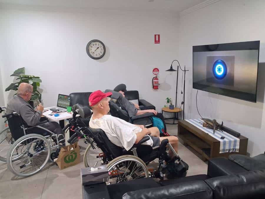 Residents relaxing together for movie night at the Evan Street home